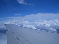 view of clouds and wing of Cebu Pacific Air